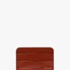 Etui na karty w kształcie koperty z ceglastoczerwonej skóry z wytłoczonym wzorem krokodyla Etui na karty w kształcie koperty z ceglastoczerwonej skóry z wytłoczonym wzorem krokodyla