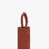Wisząca przywieszka na bagaż z ceglastoczerwonej skóry z wytłoczonym wzorem krokodyla Wisząca przywieszka na bagaż z ceglastoczerwonej skóry z wytłoczonym wzorem krokodyla
